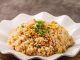 Fried Rice: Asya Mutfağının Vazgeçilmez Tadı Dünya mutfağının en sevilen lezzetlerinden biri olan Fried Rice, özellikle Asya kültüründe günlük yaşamın ayrılmaz bir parçasıdır. Pirincin baharatlar, sebzeler ve çeşitli proteinlerle harmanlanmasıyla hazırlanan bu yemek, hem pratik hem de doyurucu olmasıyla öne çıkar. Farklı ülkelerde farklı tariflerle yapılan bu yemek, çok yönlülüğü sayesinde herkesin damak zevkine hitap eder. Konulu bir haber görseli.