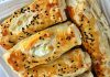 Peynirli börek, Türk mutfağının en özel ve geleneksel lezzetlerinden biridir. Çay saatlerinin en çok aranan eşlikçisi, misafir sofralarının baş tacı ve sabah kahvaltılarının olmazsa olmazı olan bu börek çeşidi, pratik hazırlanışıyla da gönülleri fetheder. Kat kat yufkaların arasına serilen lezzetli peynir harcı sayesinde ortaya çıkan doyurucu tat, hem günlük öğünlerde hem de özel davetlerde sıklıkla tercih edilir. Bugün, peynirli böreğin tarihinden yapılışına, farklı çeşitlerinden püf noktalarına kadar pek çok detayı keşfedeceğiz. Konulu bir haber görseli.